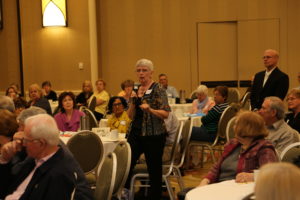 Members ask retiree leaders questions during Q&A.